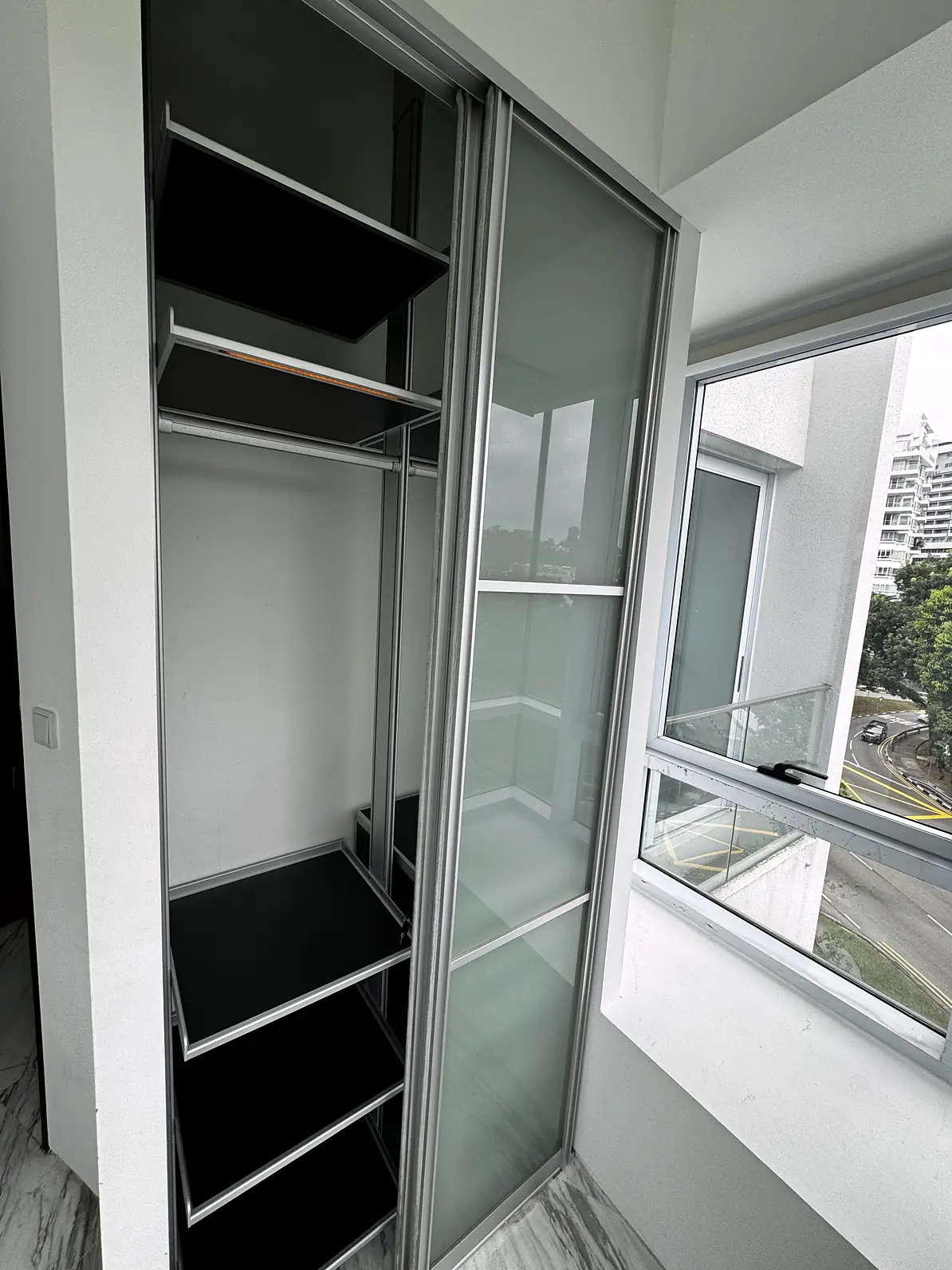 Built-in wardrobe with sliding glass doors in Fifty Two Stevens Rumah Suite Room 1