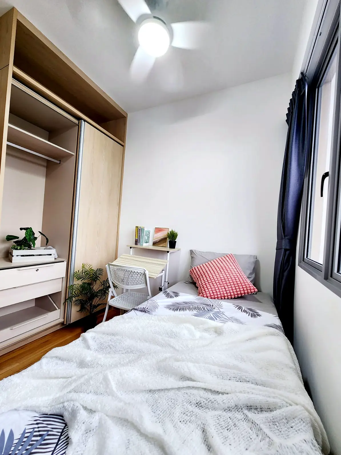 Single bed with wardrobe and desk in Harbour View Gardens Kampung Room 2