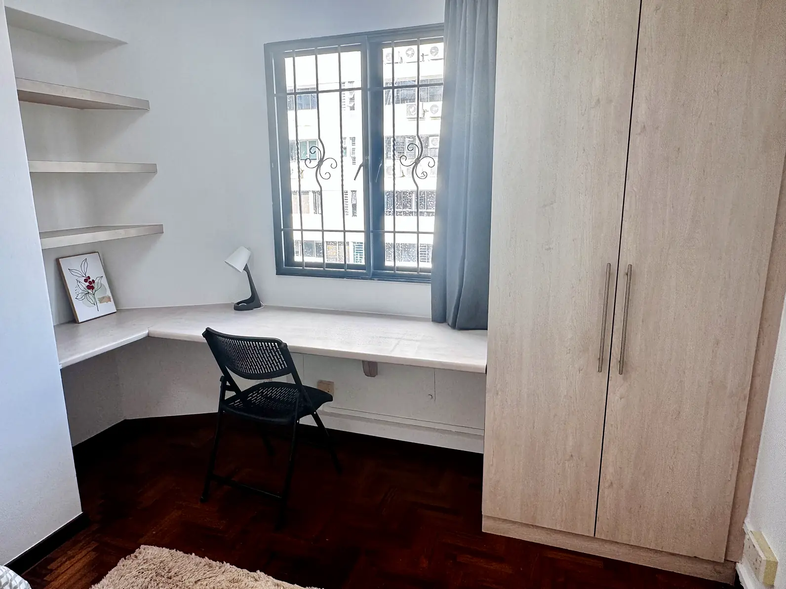Window desk and full-height wardrobe in Pandan Valley Kampung Room 2