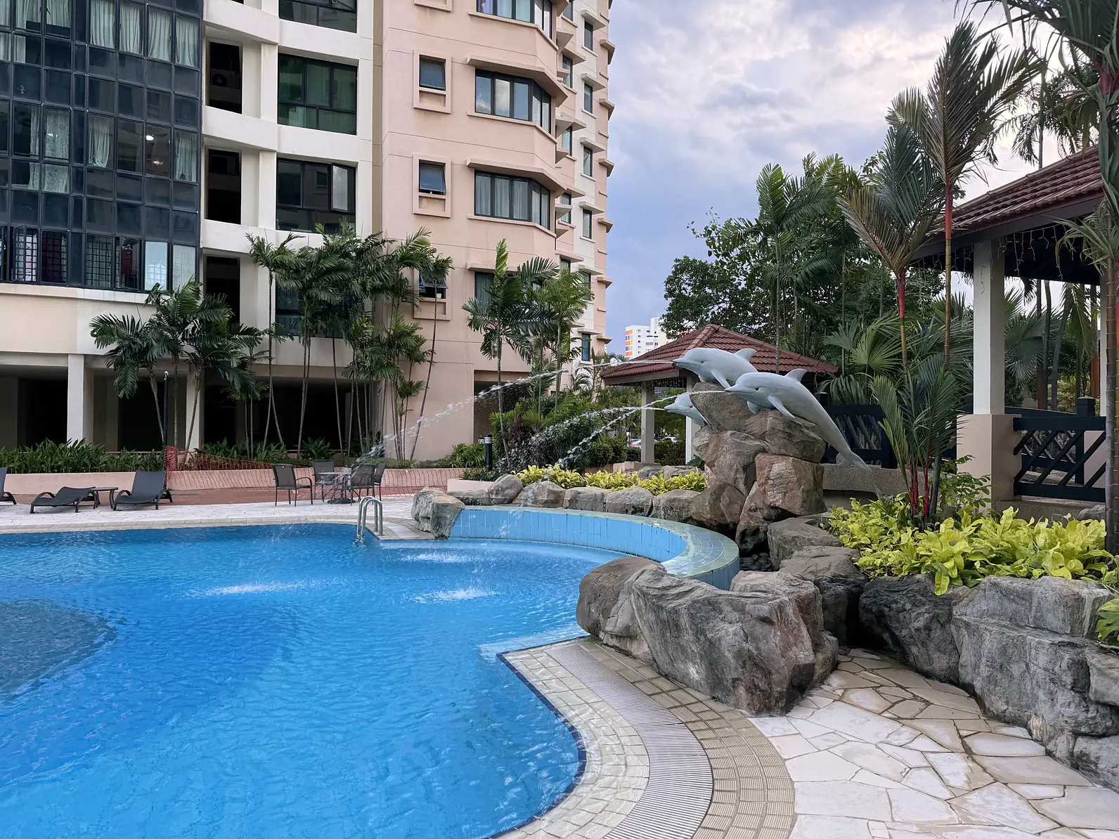 Pool with rock water feature at Simsville condo