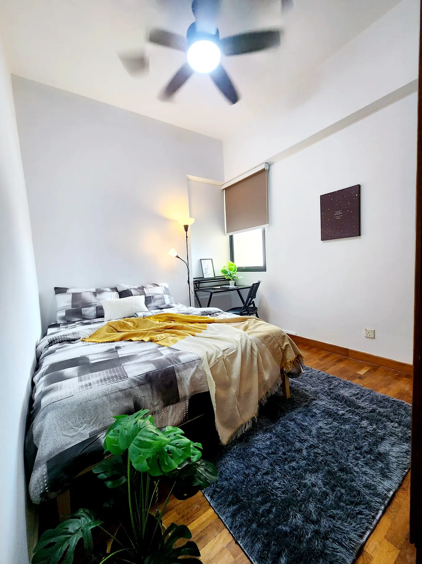 Simsville Kampung Room 2 with queen bed, ceiling fan and study desk by the window