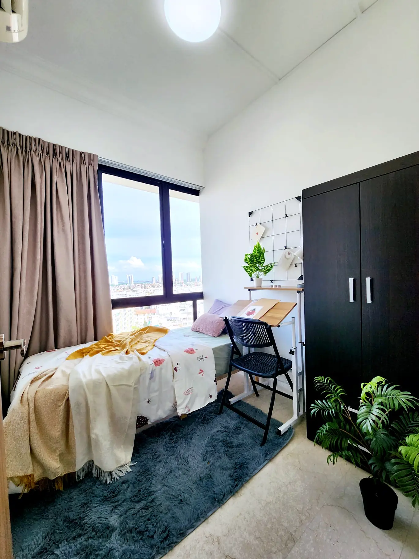 Simsville Jendela Room 4 with single bed, wardrobe, desk and full-height window