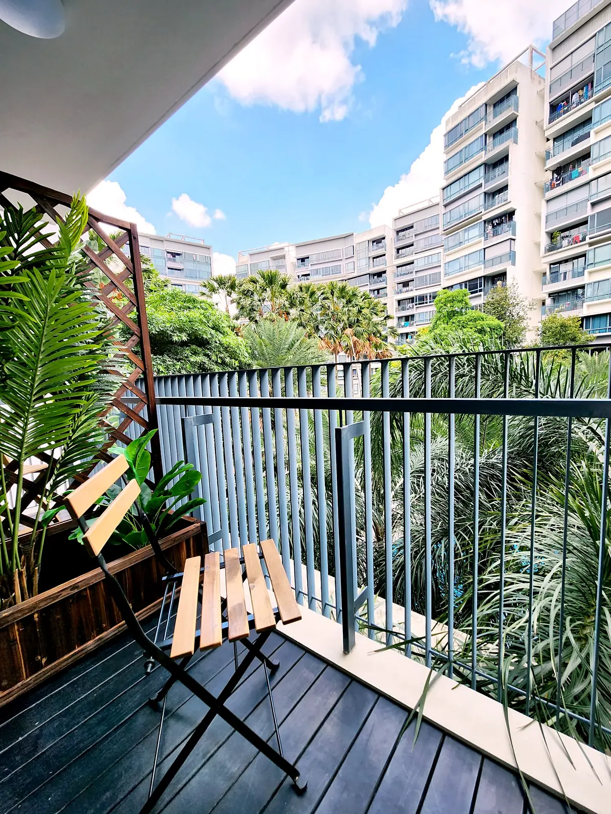 Private balcony with chair and greenery view in The Palette Jendela Room 4