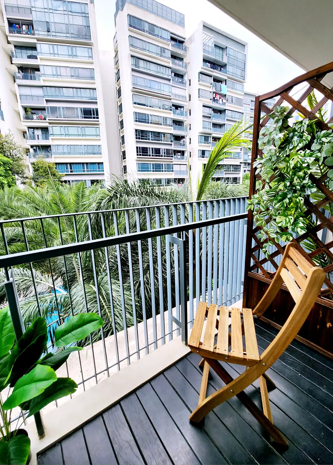 Private balcony with chair overlooking the condo greenery in The Palette Jendela Room 5